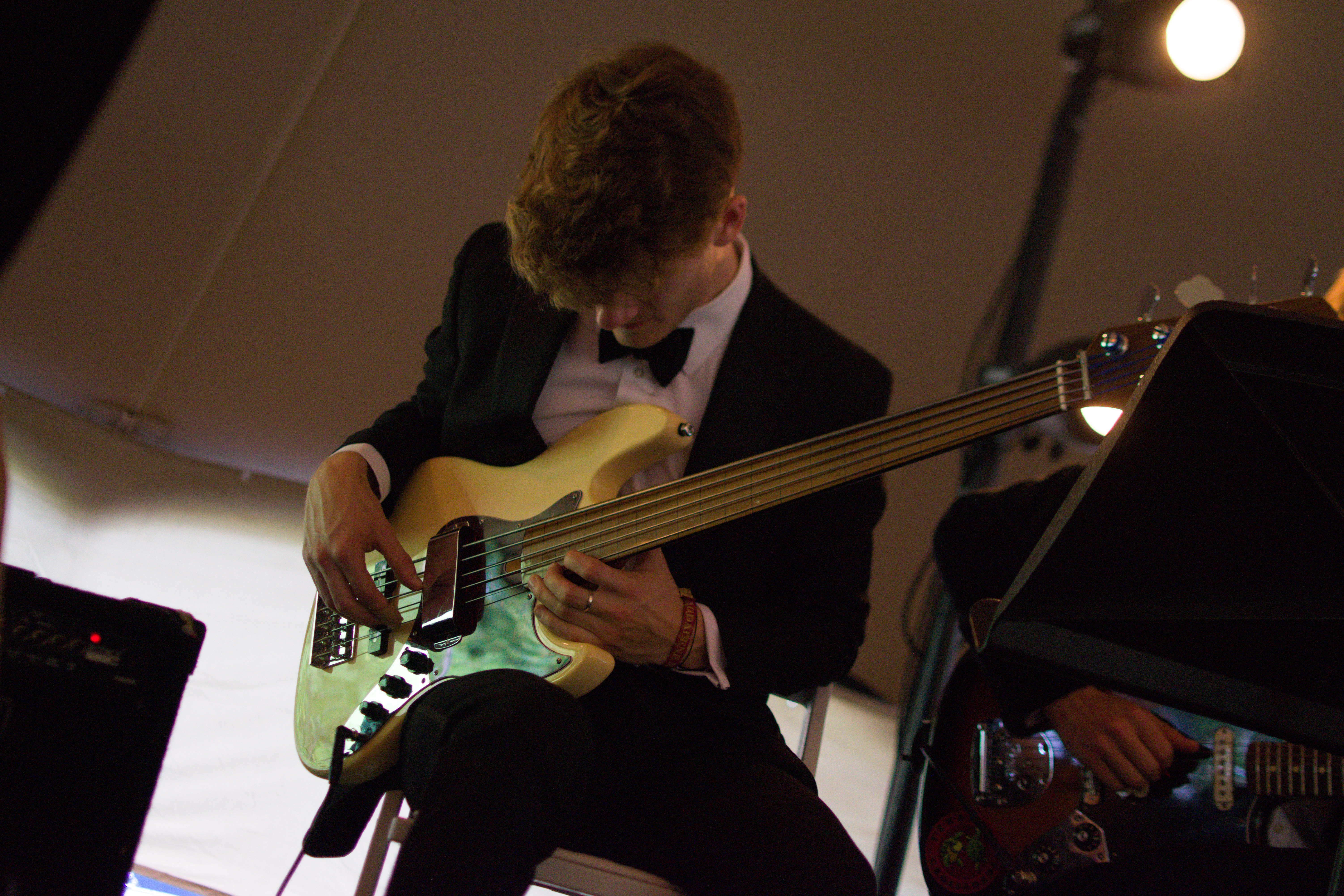Callum Walsh playing bass guitar